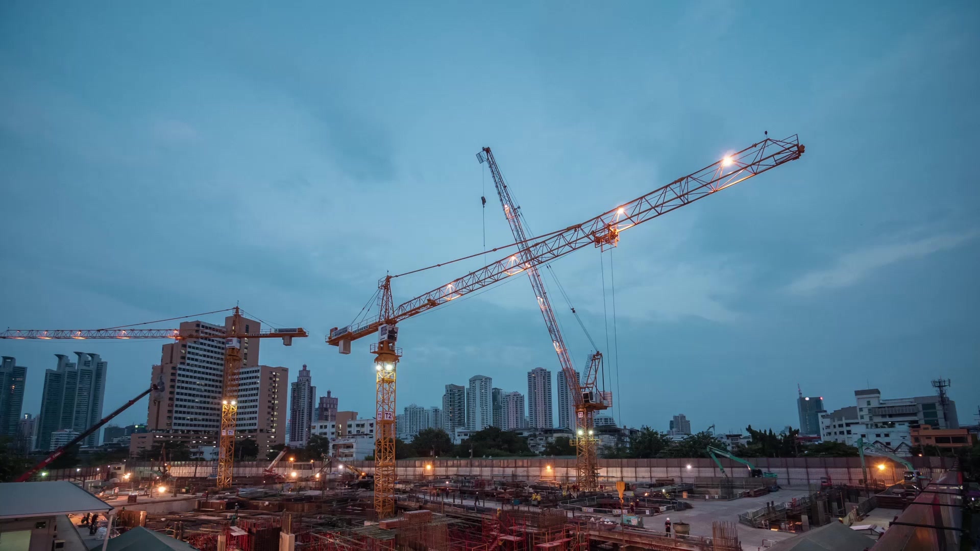 EPC project — construction cranes at dusk
